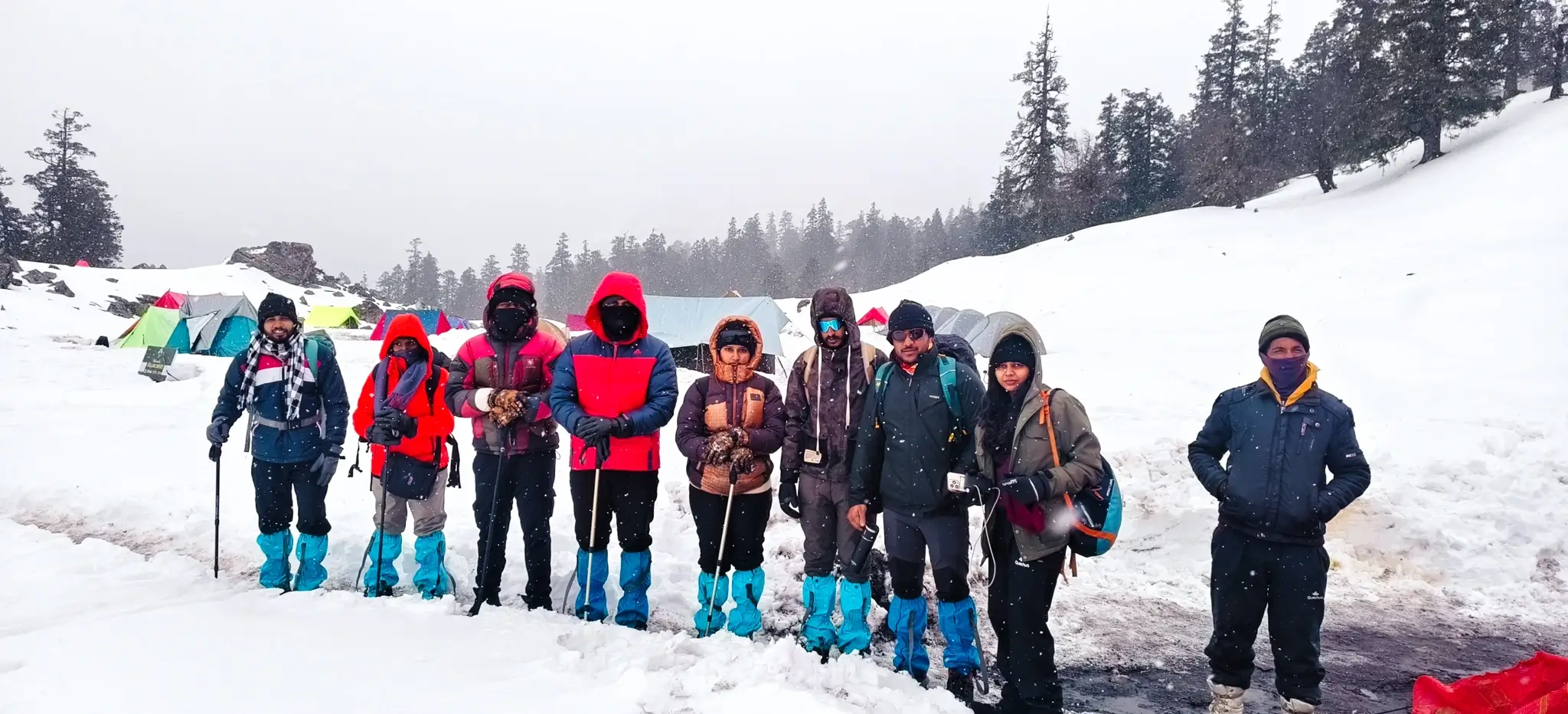 Trek group at snow camp on Kuari Pass Trek